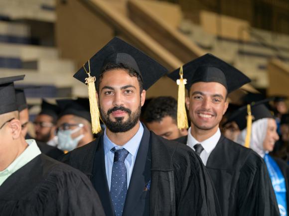 Two boys with cap and gown