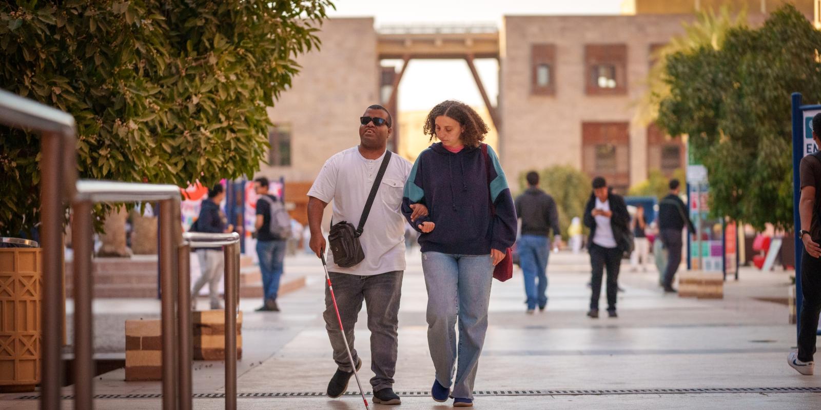 two students walking together on campus