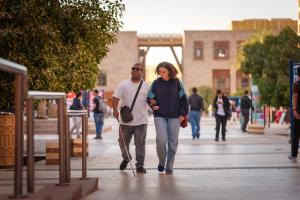 two students walking together on campus