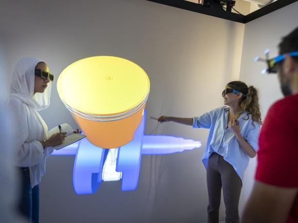 girls and boys wearing virtual glasses in front of a big screen