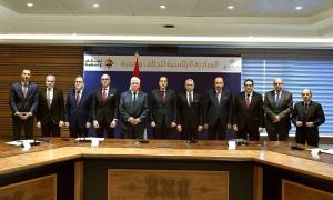 AUC President Ahmad Dallal, Professor Yehea Ismail and Hala Barakat are standing beside the Prime Minister and Minister of Higher Education and Scientific Research