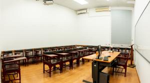 Chairs, tables, a computer and a board