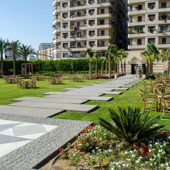 A garden with chairs and tables