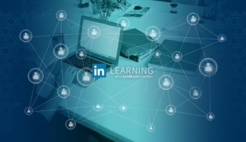 Image of a network, a hand using a laptop and books