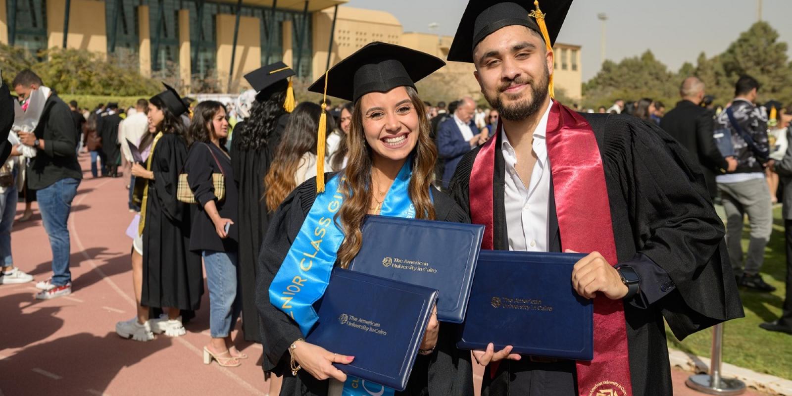 Students wearing their graduation caps and gowns