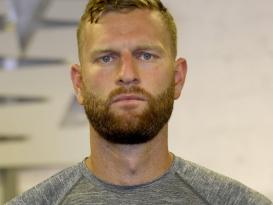 a man standing in a portrait photoshoot. 