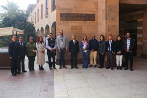 A group of people in front of the School of Sciences and Engineering