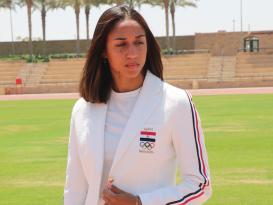 a girl with white suit in the field 