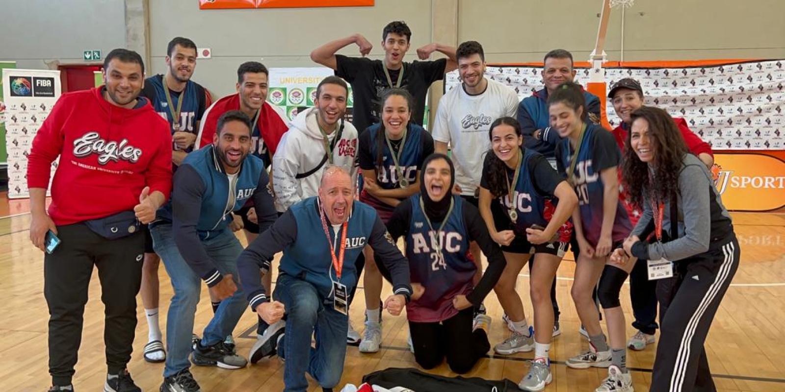 auc basketball team cheering after winning the African FASU 2023 championship