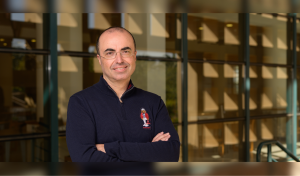 Professor Mohamed Salama standing in front of the AUC library 