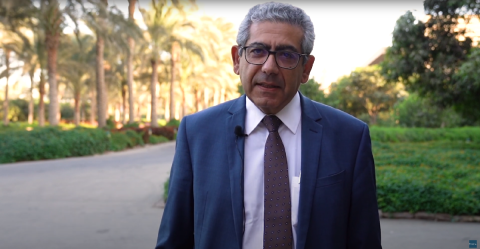 A man standing outdoors in a garden